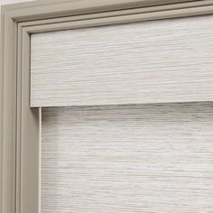 an open window with white blinds on the outside and beige shades on the top half