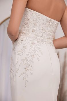 the back of a woman's wedding dress