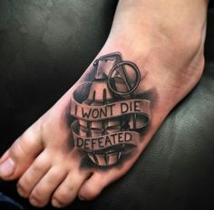 a foot with a tattoo on it that says i won't die defated