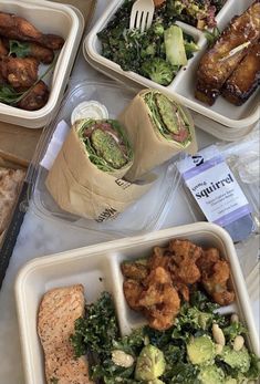 several plastic containers filled with different types of food