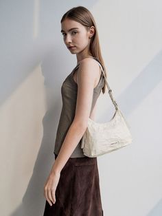 This product is made with at least 20% sustainable materials by weight. CHARLES & KEITH uses recycled, degradable, organic, and water-based materials in our eco-conscious collection. Give your look an edge with this Lark hobo bag in cream. Featuring a distinctive crinkle-effect finish, this piece will add eye-catching tactility and visual interest to any outfit. Secured with a zip closure, this bag opens up to a spacious interior that will hold all your daily essentials and then some. It also comes with 2 detachable straps that allow you to carry it as a crossbody bag or shoulder bag, depending on your style preference. Cream Bag Outfit, Hobo Bag Outfit, Cream Bags, Bag Outfit, Size Chart For Kids, Charles Keith, Daily Essentials, Eco Conscious, Sustainable Materials