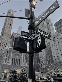 the street signs are clearly visible for everyone to see on this pole in new york city