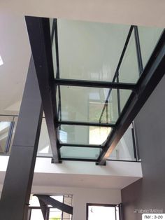 a glass and steel stair case in a house