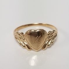 "Thanks for shopping our vintage estate store. We tend to sell well below wholesale and truly hope you enjoy all of our items. Many of the items are one of a kind, so please enjoy scrolling through the pictures and hopefully something will catch your eye. Brown spots are from camera or reflections. Estate 14k yellow gold monogram cursive capital M heart ring. Custom made ring for our shop. Ring size: 3 Setting: 7.5mm 1/4\" to 3/8\" Band width: 1.4mm Weight: 1.09 grams Marked 14k and it's sweet. 14k Gold Engraved Ring With Initials For Collectors, Personalized Engraved Yellow Gold Ring For Collectors, Classic Heart Jewelry For Collectibles, Classic Heart Shaped Collectible Jewelry, Classic Heart-shaped Collectible Jewelry, Classic Gold Initial Ring Collectible, Vintage Ring Jewelry For Valentine's Day, Gold Engraved Initial Ring Collectible, Classic Personalized Signet Ring For Collectors