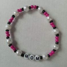 New Mom Beaded Statement Bracelet Handmade With Glass Beads Made With Durable Stretchy Elastic Cord Bright Neon Pink Beads, Pearls And Black Accent Beads Hand Crafted With Love And Care, Unique One Of A Kind They Are Sure To Bring A Pop Of Color And Style To Any Outfit While Making A Bold Fashionable Statement This Would Make A Great Gift Yourself Or Someone You Care About For Valentines Day, Mothers Day, A Birthday, Date Night, Anniversary Or Any Other Special Occasion. Contact Me If You Have A Mothers Day Clay Bead Bracelet Ideas, White Beaded Bracelet For Mother's Day, Trendy White Beaded Pearl Bracelet, Trendy White 8mm Beads, White Stretch Bracelet With 8mm Beads, White Casual Beaded Bracelets For Mother's Day, Casual White Beaded Bracelets For Mother's Day, White Casual Stretch Bracelet For Mother's Day, Casual White Stretch Bracelet For Mother's Day