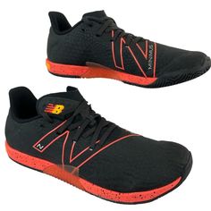 the new balance shoes are black with orange accents on the upper part of the shoe