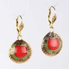 This over 3000 year old design is work of timeless elegance. An exact replica of an ancient Egyptian design from the Egyptian Museum of Cairo, these enamel on copper cloisonné earrings depict abstracted scarabs in a beautifully detailed geometric design. Lever backs ear wires for pierced ears. Size 1 1/2 Inches tall. Traditional Red Oval Earrings, Traditional Oval Red Earrings, Artistic Metal Drop Earrings, Artisan Red Copper Earrings, Red Artistic Drop Earrings, Artisan Red Jewelry With Artistic Design, Vintage Red Copper Earrings, Traditional Red Enamel Earrings, Red Enamel Traditional Earrings