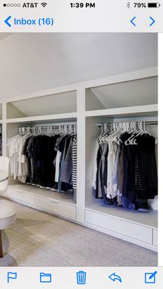 an image of a closet with clothes on hangers and chairs in front of it