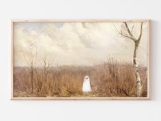 a painting hanging on the wall with a ghost in it's costume next to a tree