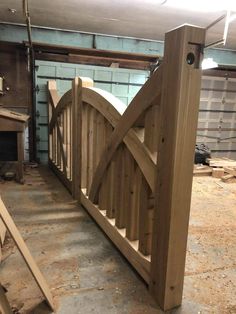 a wooden gate is in the process of being built