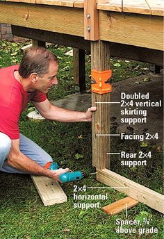 a man is working on the side of a wooden structure