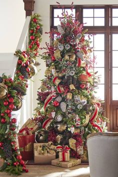 a christmas tree decorated with red and gold ornaments