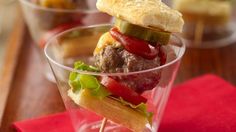 a hamburger in a glass with toothpicks sticking out of it