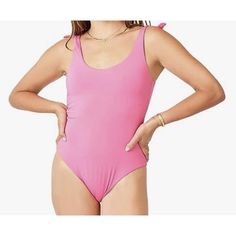 Embrace The Beach Vibes With This Stunning Carve Designs Sandhaven One-Piece Swimsuit In Fuchsia Pink. The Swimsuit Features A Stylish Designer Theme And Is Designed For Women In Regular Size S. It Is Made Of High-Quality Materials With Brand Authenticity From Carve Designs. This Swimsuit Is Perfect For All Your Beach And Poolside Adventures. It Is A New Item With Tags And Has Never Been Worn Before. The Swimsuit Is A Must-Have For Any Fashion-Forward Woman Who Wants To Make A Statement. -Our Mi Chic Pink Bodysuit For Pool, Summer Tie Back Bodysuit, Pink Sleeveless Bodysuit For Beachwear, Chic Pink Bodysuit For Vacation, Pink Tie-back Swimwear For Spring, Pink Tie-back Swimwear For Beach Season, Pink Tie-back Swimwear For Poolside, Pink Sleeveless Beachwear Bodysuit, Casual Pink One-piece Swimsuit For Pool