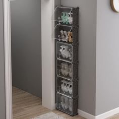 an over door shoe rack holds shoes and other items in the corner of a hallway