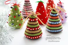 small crocheted christmas trees with bows on them