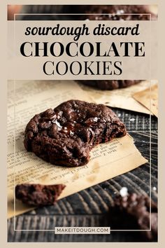 a close up of a chocolate cookie on top of a piece of paper with the words sourdough discard chocolate cookies