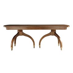 a large wooden table with two legs on each end and an oval shaped center piece at the top