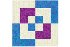 a blue and purple quilt with white squares on the bottom, one block is in the middle