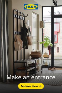 there is a coat rack with hats and purses on it in the entryway