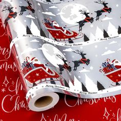 christmas wrapping paper with santa's sleigh and reindeers on red background