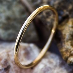 "This Gold stacking ring is entirely hand-made & mixes well with most of the items in our store. * This listing is for (1) one ring. * Made with: 16g (1.29 mm) 12k Yellow Gold-filled wire. * When stacked, they measure at about 7 rings per half inch. * We do make 1/2 & 1/4 sizes, just leave a note with your size preference. * All of our items are entirely hand crafted and have a standard processing time of 3-5 Business days to make the order. * Items are processed in the order they are pu Classic Stackable Toe Rings, 14k Gold Stackable Round Bands, Stackable 14k Gold Round Rings, Stackable Yellow Gold Couple Rings, Yellow Gold Stackable Couple Rings, Classic 14k Gold Hoop Rings, Stackable 14k Gold Couple Rings, Everyday Yellow Gold Couple Rings, Yellow Gold Stackable Round Midi Rings