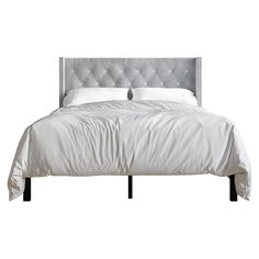 a bed with white sheets and silver headboard on it's side, in front of a white background