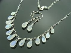 Genuine Rainbow Moonstone Drops Necklace and Earrings SetEarrings are 37 mm long.Necklace is 18" long .Weight : 37 CtAll components are 925 Sterling Silver.Set comes with a free gift box. Sterling Silver Teardrop Jewelry, Sterling Silver Teardrop Stones Jewelry, Sterling Silver Drop Jewelry With Stones, Sterling Silver Drop Jewelry With Natural Stones, Sterling Silver Jewelry With Briolette Stones, Long Drop Moonstone Jewelry With Matching Earrings, Silver Briolette Moonstone Jewelry, Drops Necklace, Set Earrings