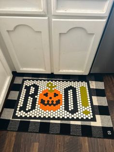 A kitchen mat made with rubber tile. The tiles can be removed and made into custom designs. This design spells “boo” with the middle “o” as a jackolantern. The mat is made by the company: letterfolk. Modern Cuckoo Clocks, Modern Doormats, Brand Guide, Modern Door, Jump In, Everyday Moments