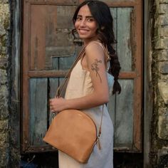 Designed for life on the go, this is a great crossbody bag that you'll hardly feel you are carrying. Remove the strap and make it a clutch! FREE SHIPPING (US Domestic) Handmade in India Materials: full grain leather; hand-block printed lining Dimensions: 10.5 in. L x 8 in. H x 2.5 in. D; adjustable crossbody strap 57 inches. Full zip close; 2 exterior open pockets, 1 interior zipped pocket; fully lined Have you considered a Zee Bee Market Gift Card? A meaningful gift that lets your recipient dec On-the-go Pouch Saddle Bag, Leather-lined Saddle Bag For On-the-go, Camel Crossbody Shoulder Bag For On-the-go, Camel Crossbody Shoulder Bag For Travel, Camel Bags For Everyday Use, Leather Handles Saddle Bag For Travel, Leather Handle Saddle Bag For Travel, On-the-go Cognac Shoulder Bag, Light Brown Crossbody Shoulder Bag For Travel