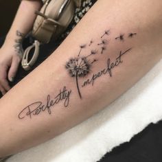 a woman's arm with a dandelion tattoo that reads, perfectly imperfect