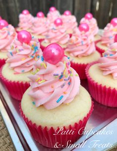 cupcakes with pink frosting and sprinkles