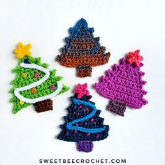 three crocheted christmas tree ornaments on a white surface with the words sweet bee crochet