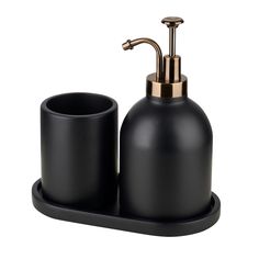 a black soap dispenser and cup on a white background with gold accents