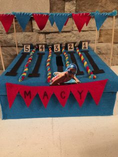 a table that has some kind of game on it with flags and bunting around it