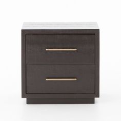 a black and gold nightstand with two drawers on it's sides, against a white background