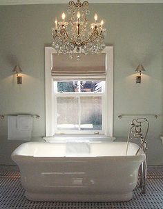 a white bath tub sitting next to a window