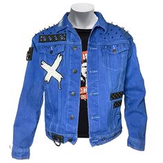 This denim jacket is ready to rock your world. Donned with gunmetal studs and rounded point shoulder spikes that boast pure attitude, it unleashes your rebellious spirit and tells the mainstream exactly where they can stick it. Slip it on and feel the punk prophecy fulfilled--you're a one-man mosh pit, a hardcore legend. The dyed royal blue denim backdrop is the perfect canvas for proclaiming your musical allegiances via patches and pins, not to mention it's durable enough to withstand the wear and tear of your angsty escapades. Forget flower power, this battle jacket is armed for an all-out assault on conformity. Once you shrug it on, there's no going back...you're punk to the core. Are you ready to pledge your allegiance to anarchy? This jacket is. Punk Outerwear With Studs For Streetwear, Punk Style Studded Outerwear For Streetwear, Punk Spiked Outerwear For Streetwear, Punk Outerwear With Spikes For Streetwear, Punk Biker Jacket With Spikes For Streetwear, Rocker Outerwear With Studs For Alternative Fashion, Studded Rocker Outerwear For Alternative Fashion, Studded Alternative Style Outerwear, Alternative Spiked Outerwear For Concerts