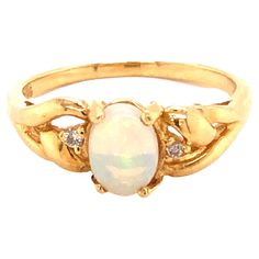 White Opal & Diamond Ring in 14k Yellow Gold. The oval cabochon opal is set in 4 prongs and measures approximately 7.1mm x 5.1mm x 3.1mm. The opal has beautiful color play with amazing green, blue and orange hues. The ring set with 2 diamonds totaling ~0.02 carats. The ring has braided design shoulders and rounded tapered shank with a high polish finish. The ring is size 6.75 and can be easily re-sized for a small fee. Stamped "585" "14K" on the inside. Total weight is 2.8 grams. Preowned in ver Ring On Hand, Opal And Diamond Ring, Opal Diamond Ring, Hand Rings, Orange Hues, Braid Designs, Color Play, White Opal, Oval Cabochon