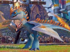 a blue and orange dragon standing in front of a group of people on a field