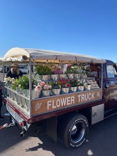 a flower truck parked in a parking lot