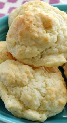 three biscuits stacked on top of each other in a blue plate