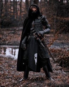 a man dressed as a knight in the woods