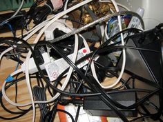 many wires and cords are tangled together on the floor