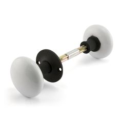 two black and white knobs on a white background