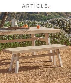 a picnic table with two benches on it and the words article written in front of it