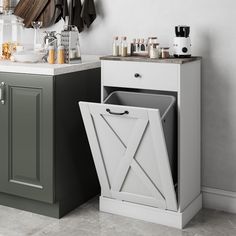 a kitchen area with sink, cabinets and utensils