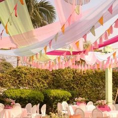 tables and chairs are set up outside for a party