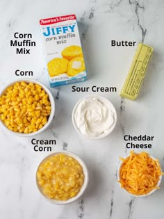 ingredients to make cornbreads in small bowls on a marble counter top with labels