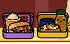 two suitcases filled with food sitting on top of a table